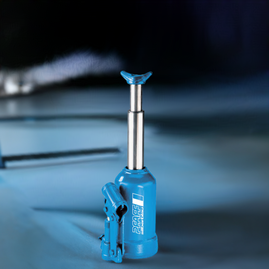 Blauer hydraulischer Pfaff-silberblau Flaschenwagenheber HWH PROLINE mit ausgefahrenem Kolben auf Werkstattuntergrund