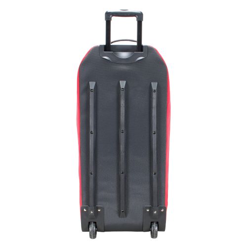 Black and red hard-shell trolley bag with telescopic handle and dual wheels, rear view.
